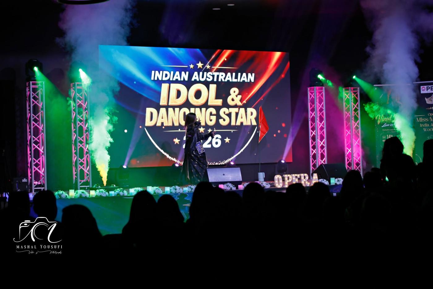 The stage under smoke and lights during a performance