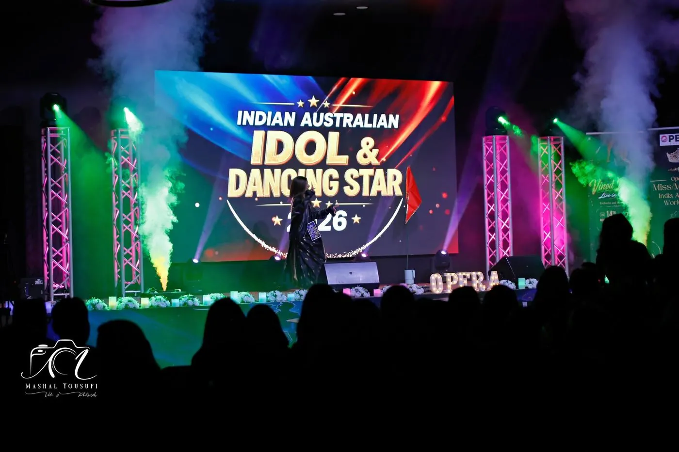 The stage under smoke and lights during a performance